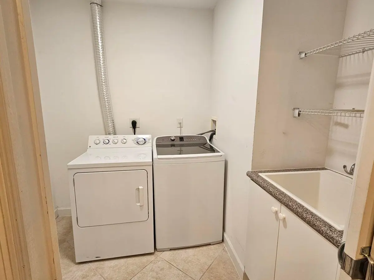 Next to kitchen laundry room with sink at 801 S Olive Avenue 1604, West Palm Beach