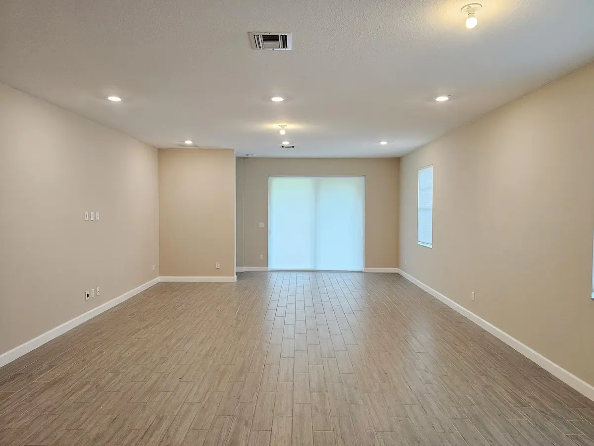 Living Room at 1284 HAYWAGON Trail, The Acreage