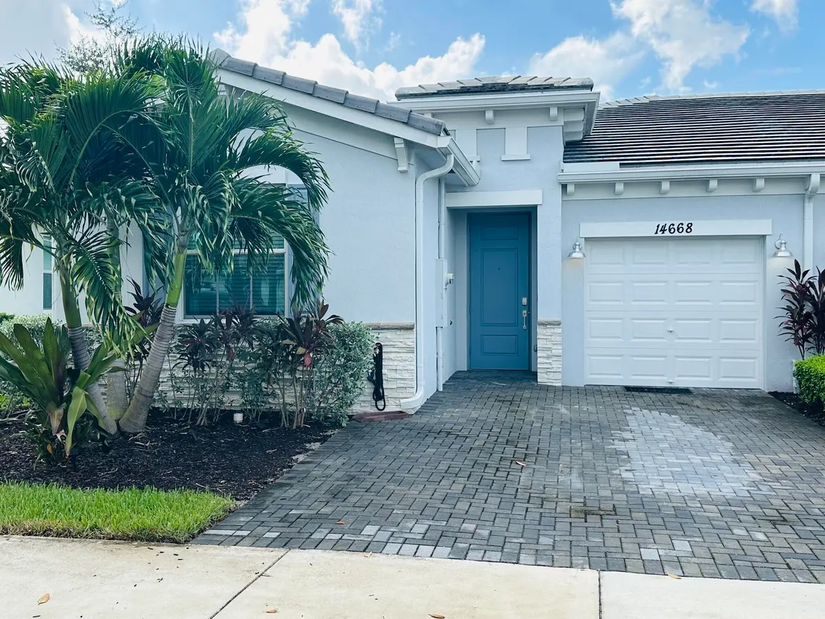 front of home paver driveway at 14668 THREE PONDS Trail, Delray Beach