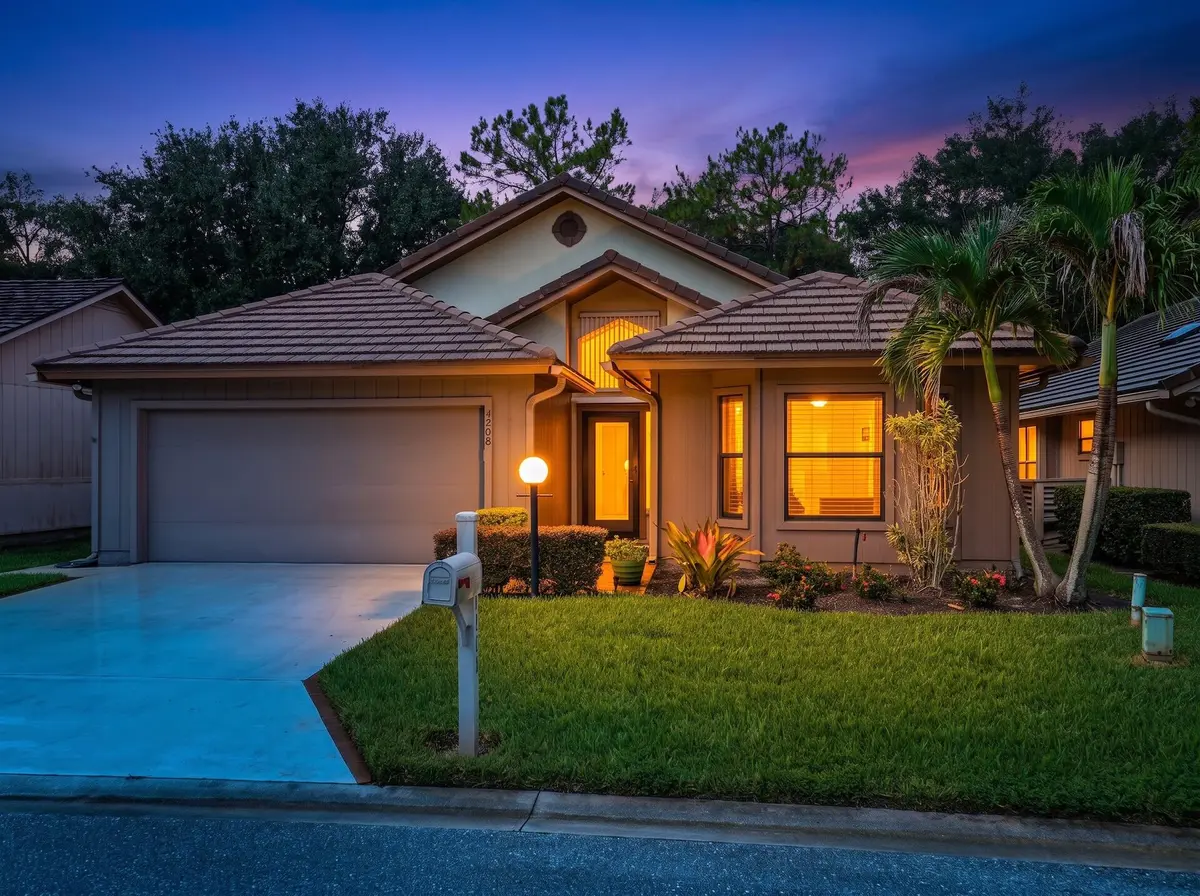 39_Front_Exterior_Twilight at 4208 SW Mallard Creek Trail, Palm City