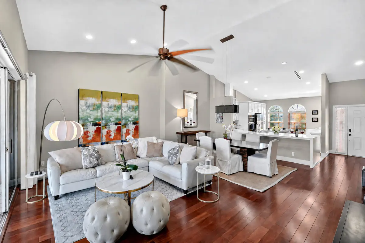 03_Open_Concept_Living_Dining_Kitchen at 305 Ryder Cup Circle, Palm Beach Gardens