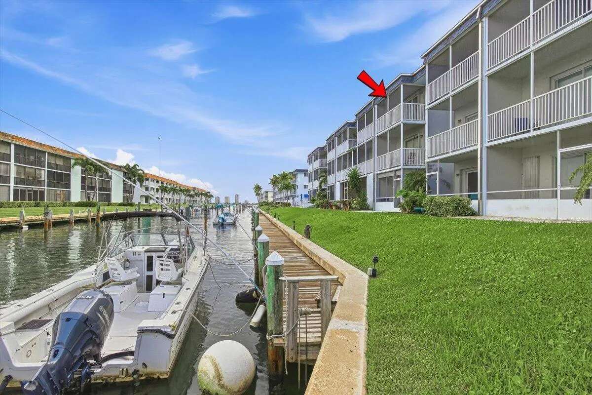 Back Building Canal at 131 Doolen Court 309, North Palm Beach