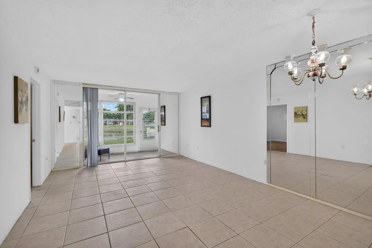 Living room and dining room at 8100 Sunrise Lakes Boulevard 109, Sunrise