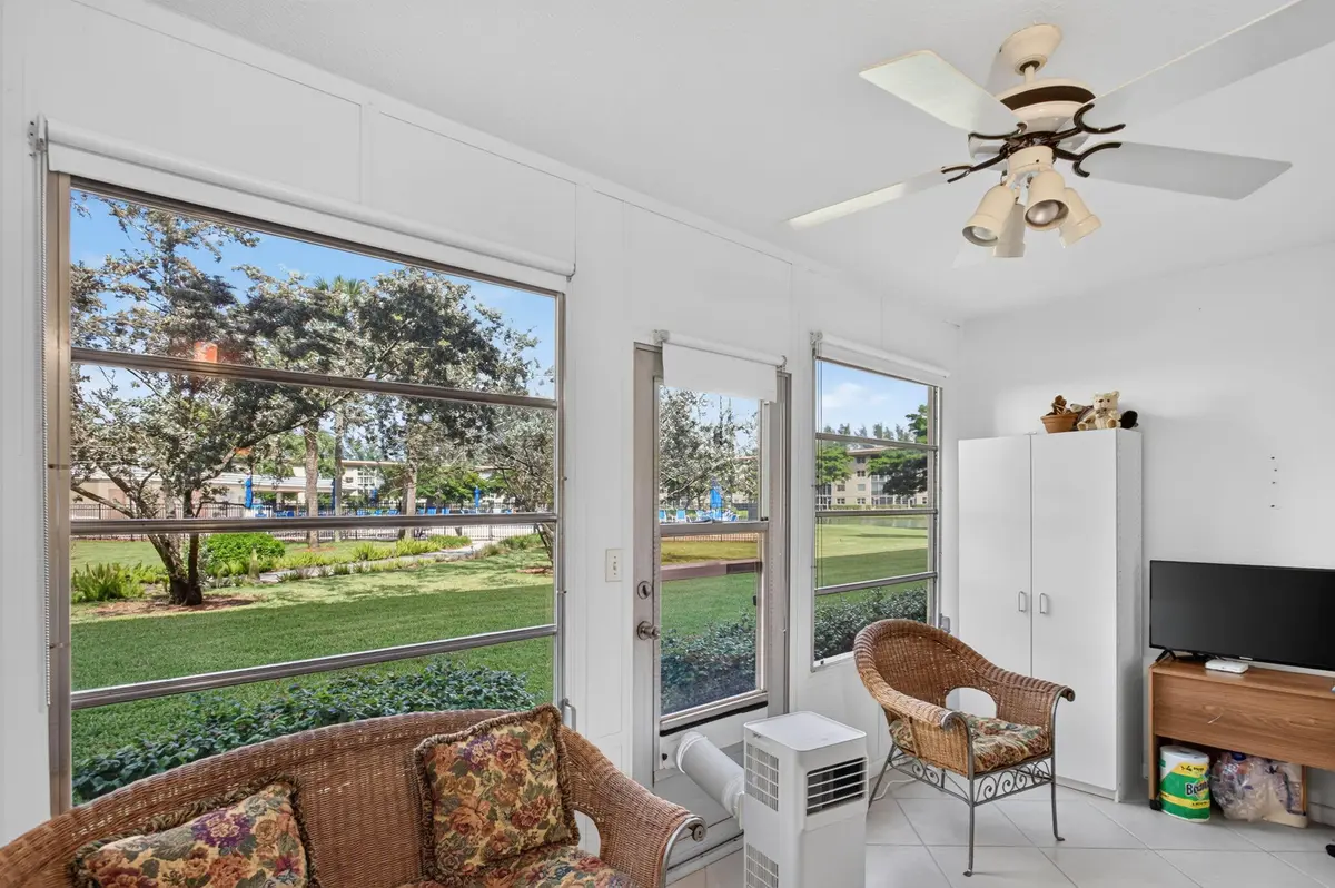 ENCLOSED PATIO DOOR TO POOL at 1804 Eleuthera Point A1, Coconut Creek