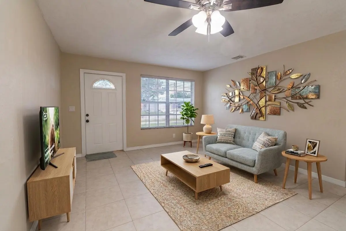 Virtually staged family room at 2032 WORTHINGTON Road, West Palm Beach