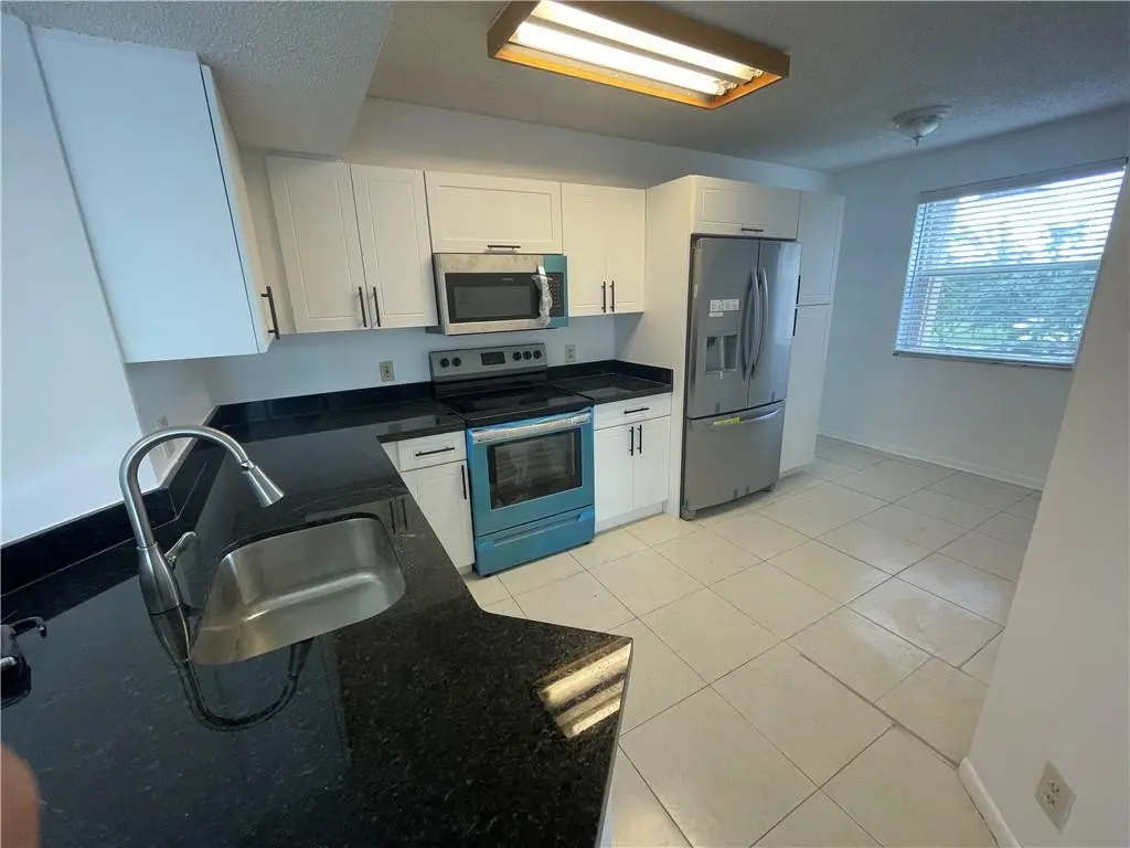 Photo 4 at 9033 WILES Road 302, Coral Springs