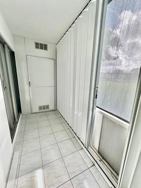 Screened Patio w/Accordion Shutters at 14 Fanshaw A, Boca Raton