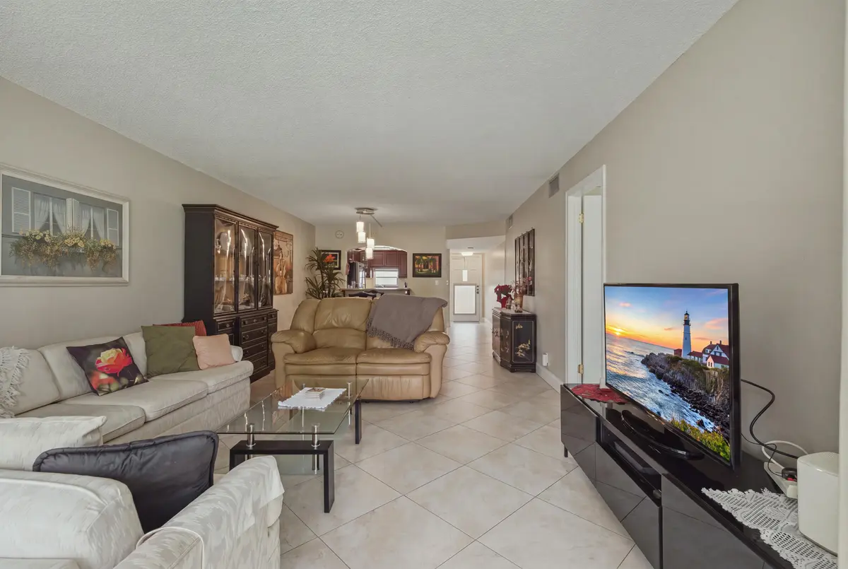 2. Living Room to Front Door at 811 S Hollybrook Drive 202, Pembroke Pines