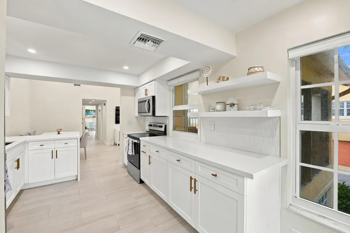 68_042__jjl6668_with_tv at 2121 S Ocean Boulevard 106, Lauderdale-By-The-Sea