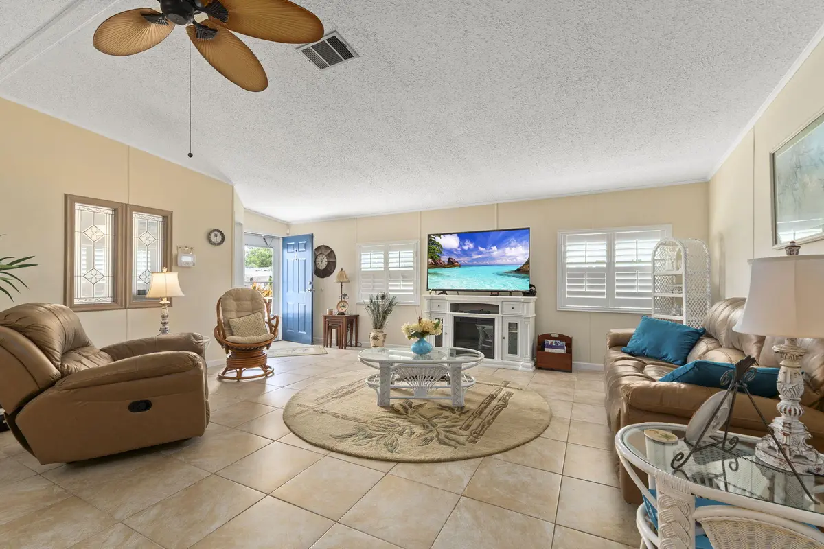LIVING ROOM - TILE THROUGHOUT HOME at 3342 COLUMBRINA Circle, Port St. Lucie