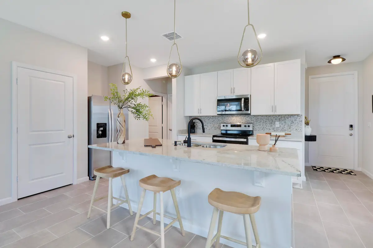Kitchen island with bar seating at 261 OSPREY PRESERVE Boulevard, Jensen Beach