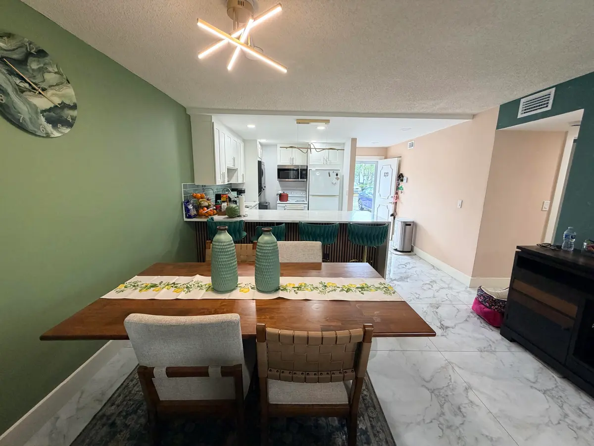 Dining area to kitchen at 6161 NW 2nd Avenue 123, Boca Raton