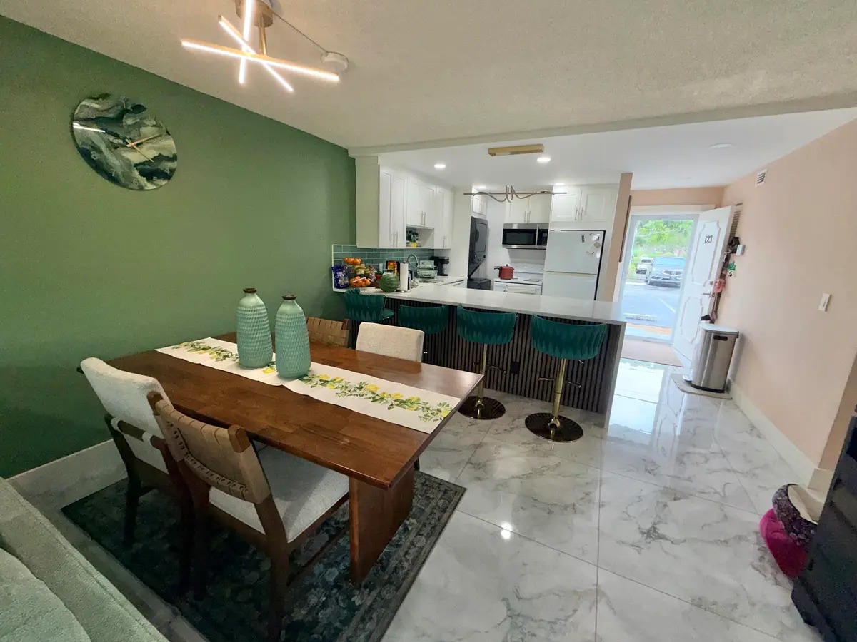 Dining area to kitchen at 6161 NW 2nd Avenue 123, Boca Raton