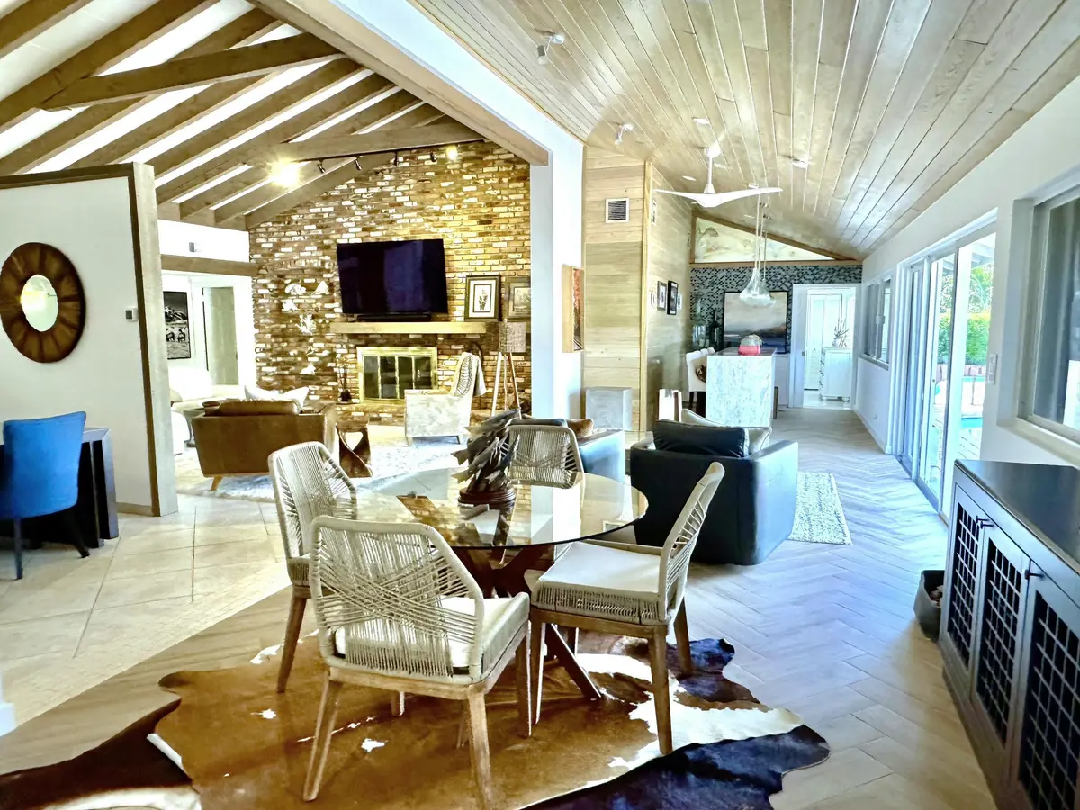 Family room overlooking pool & water at 4011 NE 27th Terrace, Lighthouse Point