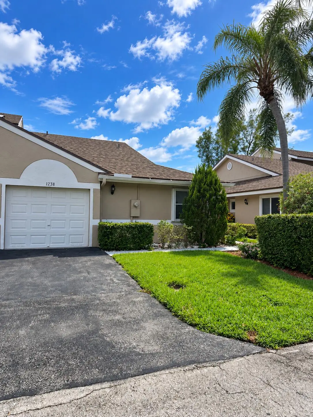 Sunny Beige Townhouse with Palm Tree at 1238 NW 51ST Way 1238, Deerfield Beach