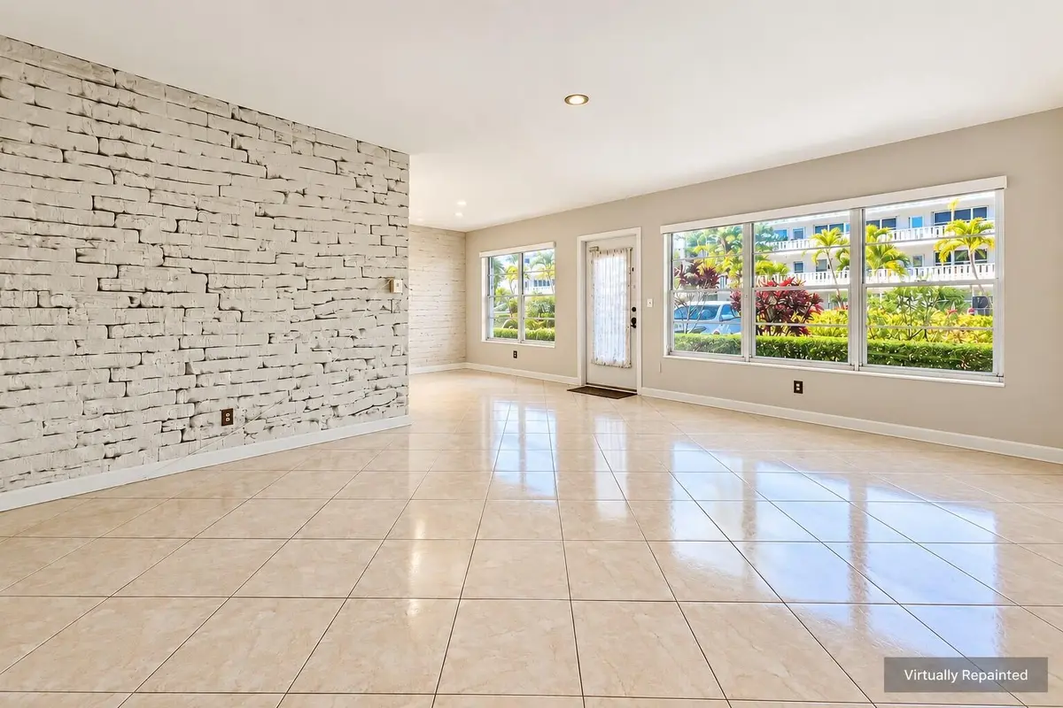 Sunlit Virtually Repainted Living Room at 110 WELLINGTON B, West Palm Beach