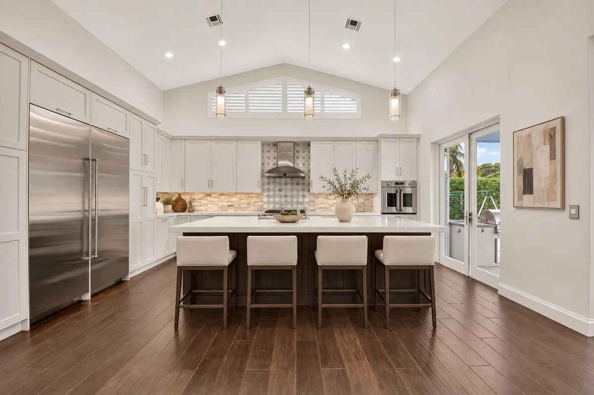 Refined neutral kitchen with ivory stool at 5757 HARRINGTON Way, Boca Raton