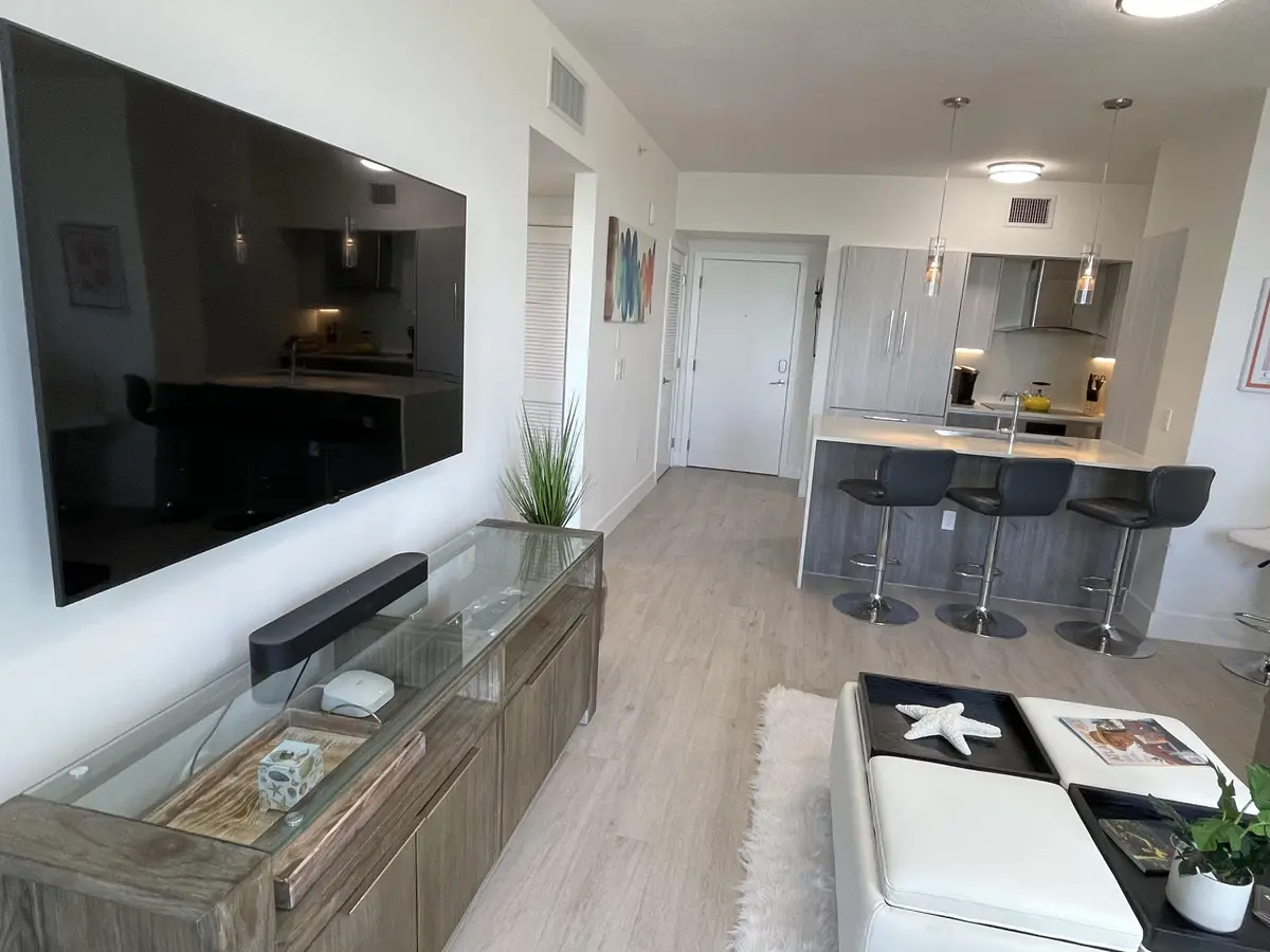 Living Room to kitchen view at 111 SE 1st Avenue Unit 502, Delray Beach