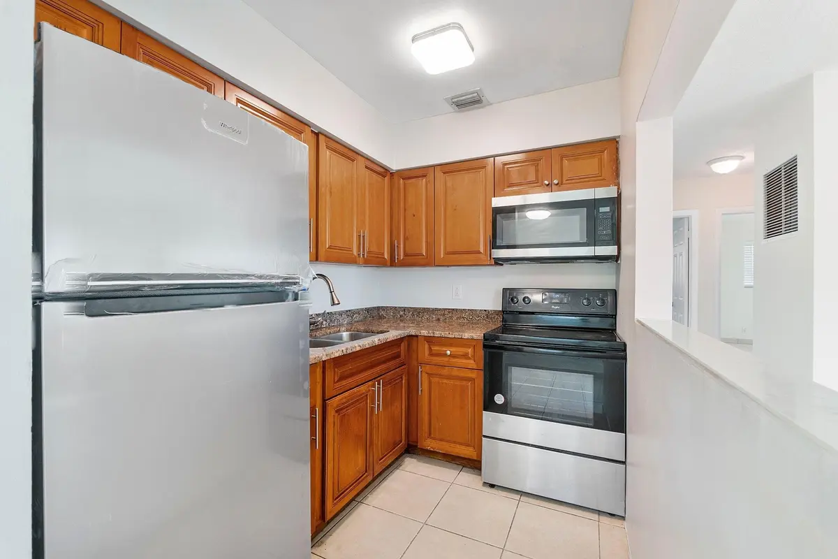 kitchen_tape_removed_v3 at 251 NE 40th Street #251, Oakland Park