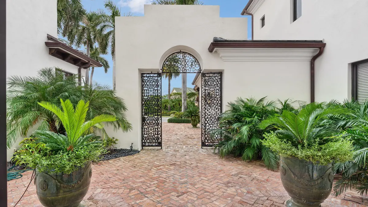 Gated front entrance at 1014 Grand Court, Highland Beach