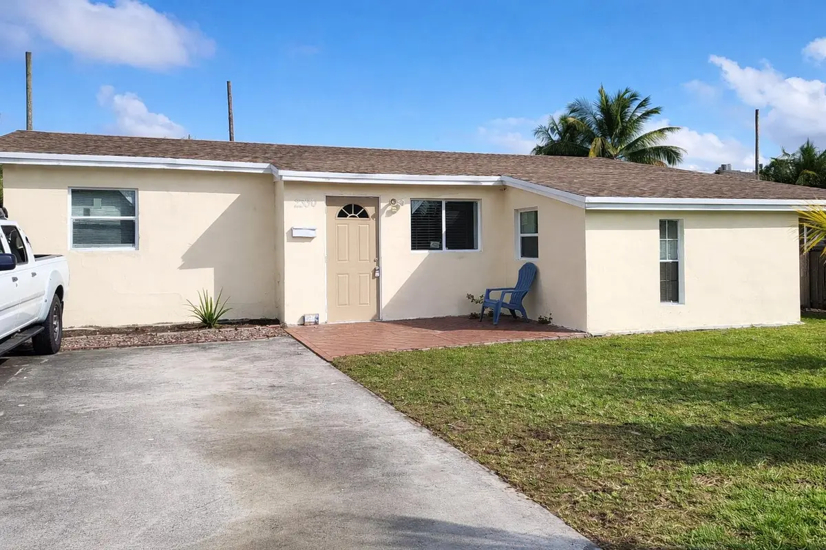 A charming suburban home midday at 2330 NE 1ST Avenue, Pompano Beach