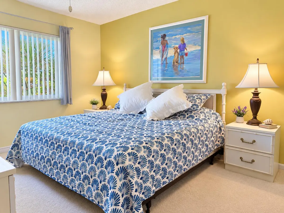 Coastal Bedroom with Seashell Quilt at 5811 NE GULFSTREAM Way 4002, Hutchinson Island