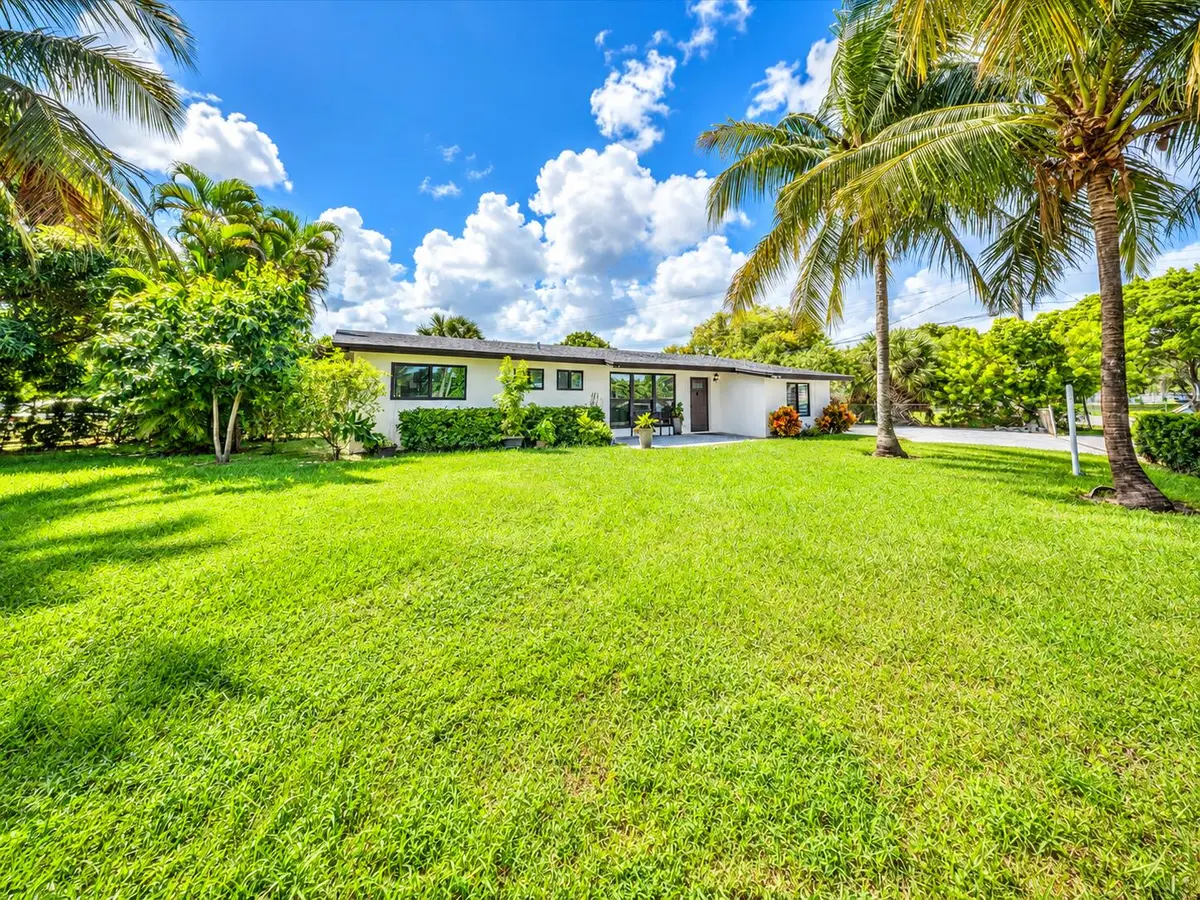 Tropical Ranch House with Expansive Lawn at 5051 NE 6TH Avenue, Deerfield Beach