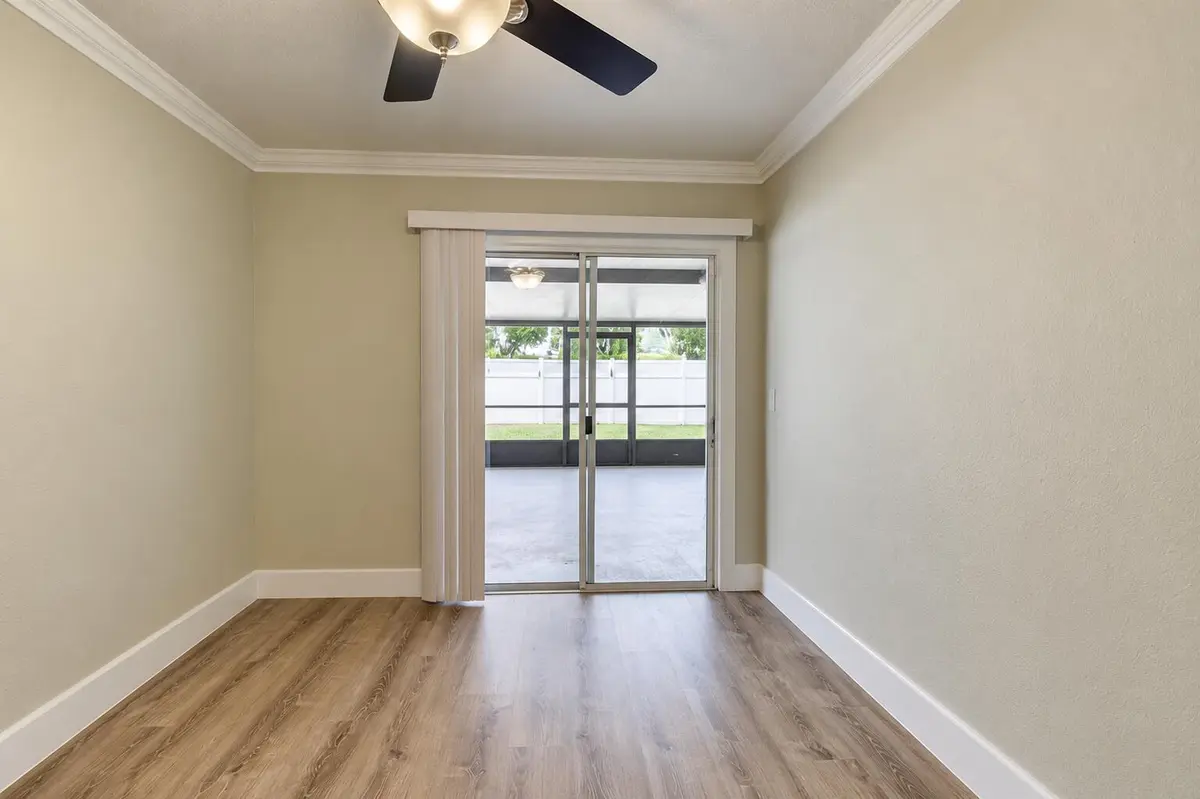 Empty Modern Room with Patio View at 8379 Garden Gate Place, Boca Raton