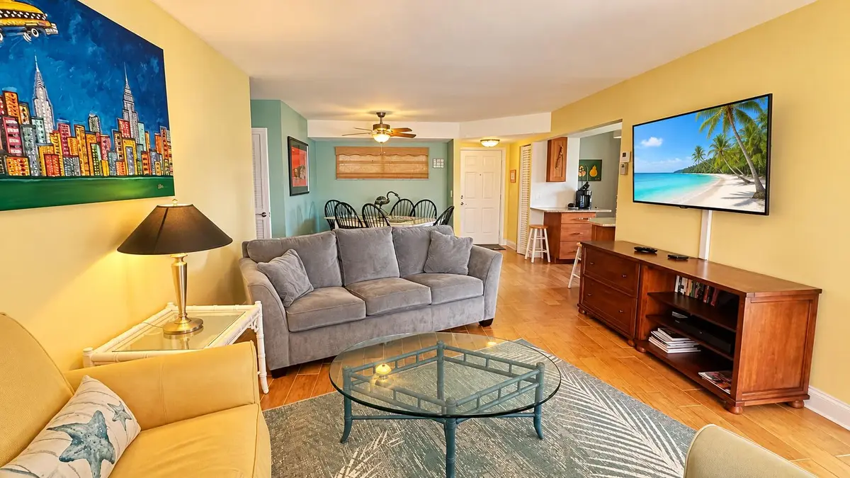 Sunlit luxury living room with tropical at 2 COLONIAL CLUB Drive 101, Boynton Beach