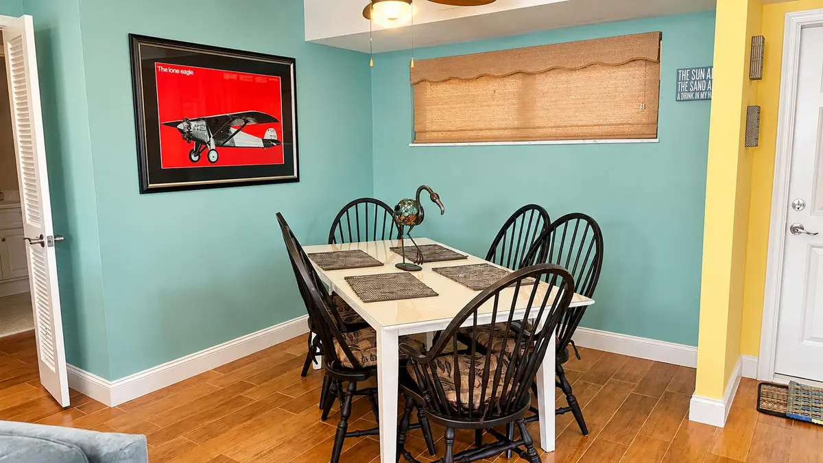 Elegant Aqua Dining Room Glow at 2 COLONIAL CLUB Drive 101, Boynton Beach