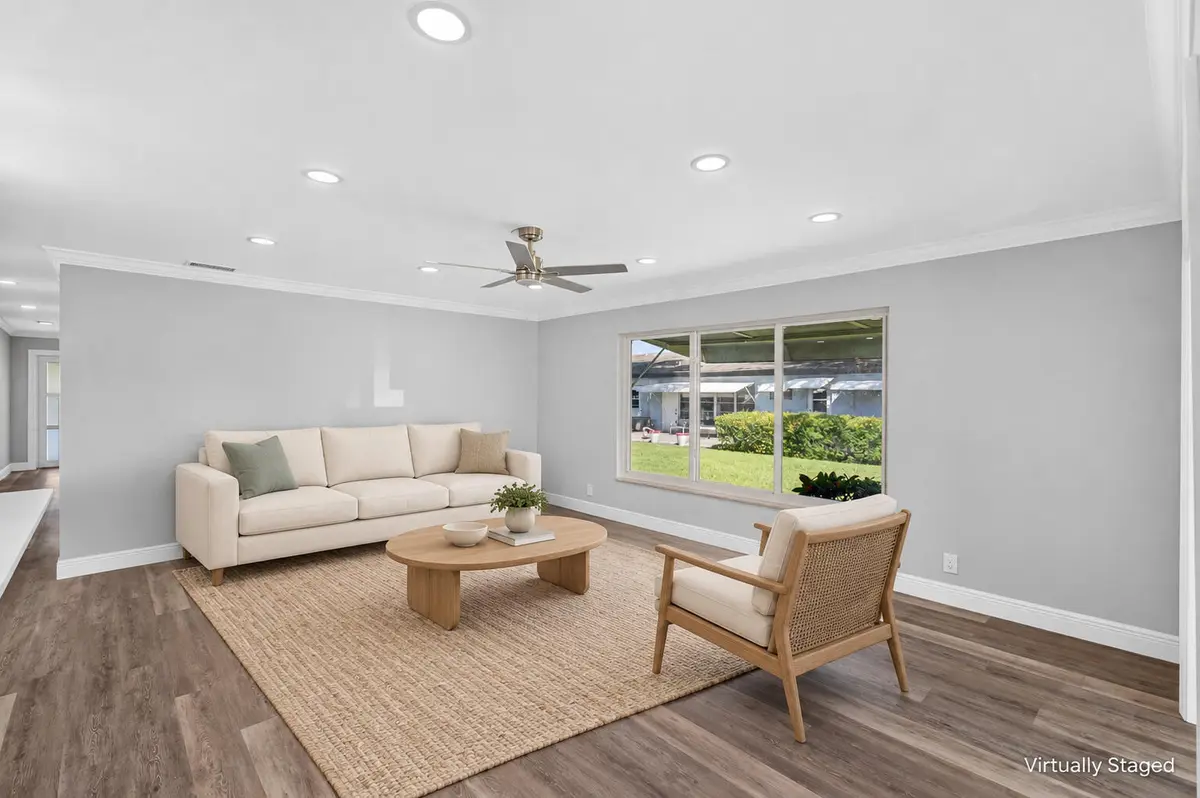 04_Living_room_Virtually_staged at 455 High Point Boulevard D, Delray Beach