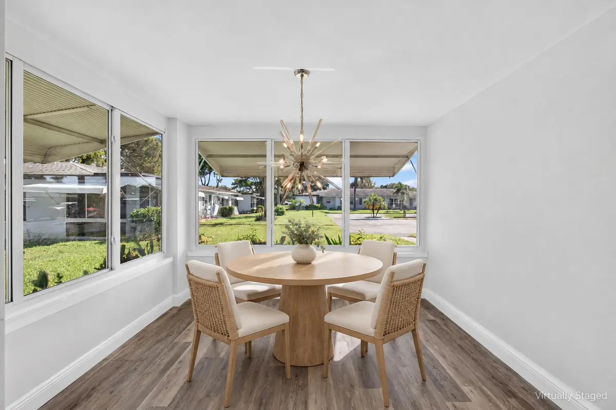 05_Dining_room_Virtually_staged at 455 High Point Boulevard D, Delray Beach