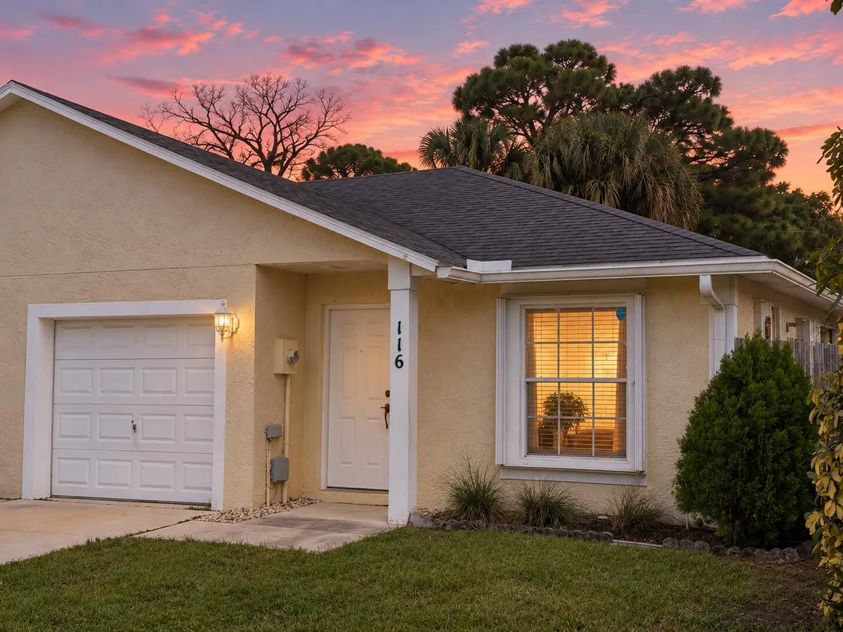 Suburban Sunset Home at Dusk at 116 PHEASANT RUN Boulevard 116, West Palm Beach