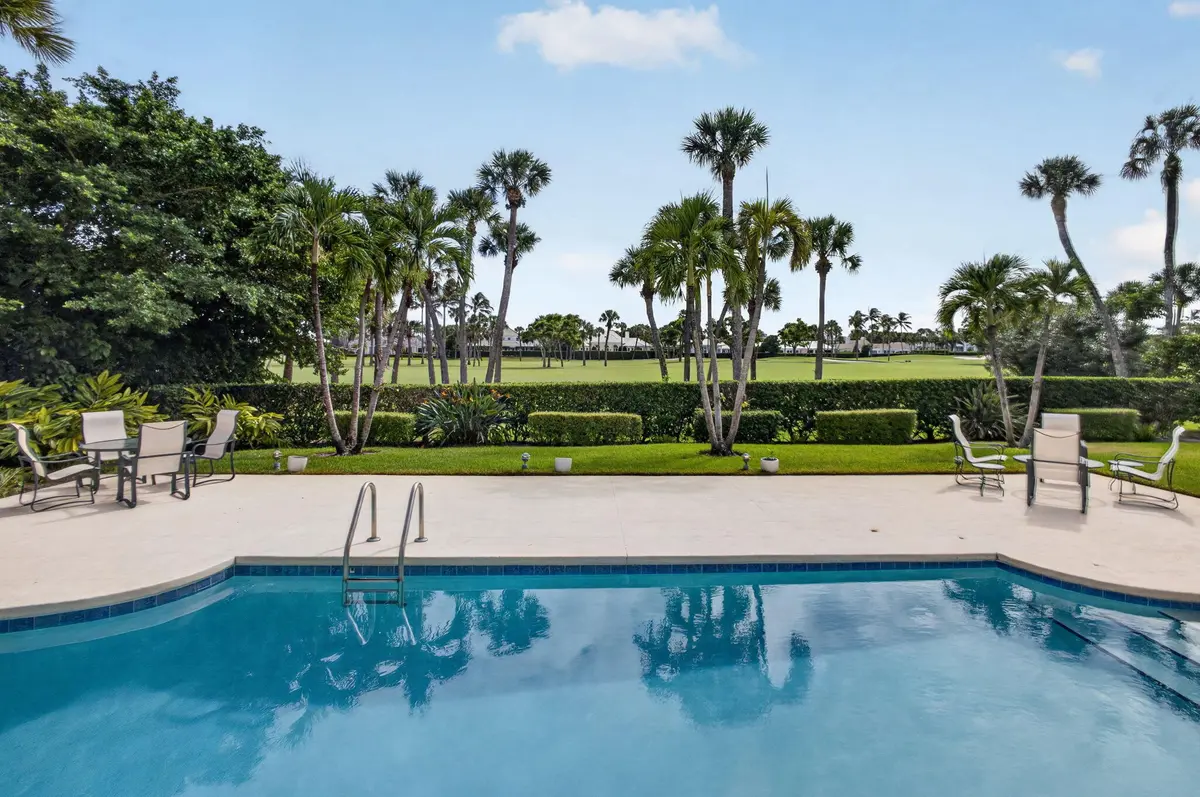 Pool view of golf course at 934 Palm Way, North Palm Beach