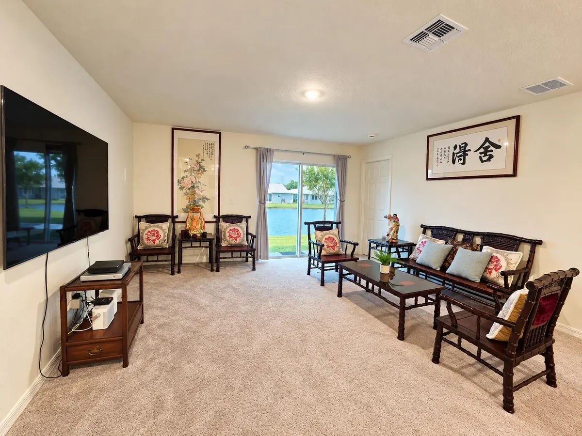 Living room with water view at 698 SE 25TH Drive, Okeechobee
