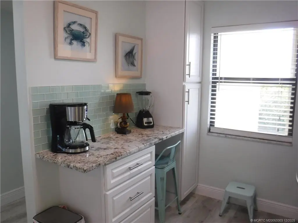 Kitchen sitting area with pantry at 7380 S Ocean Drive 517, Jensen Beach