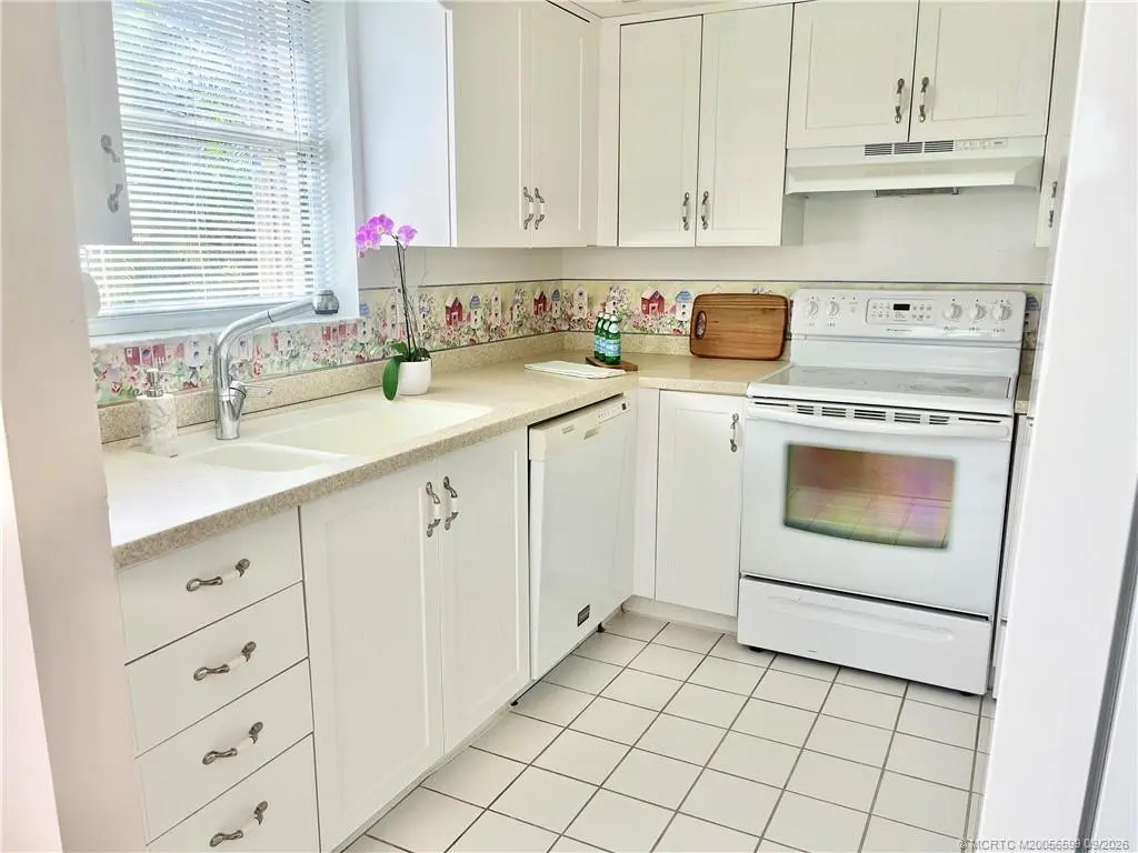 Bright kitchen at 911 SW South River Drive 107, Stuart