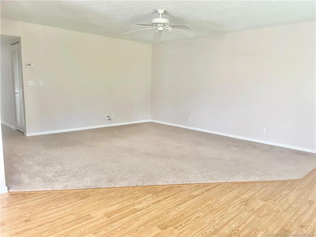 Living room at 911 SW South River Drive 107, Stuart